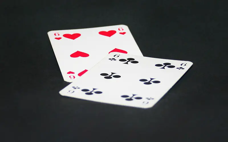playing cards six of clubs and six of heart