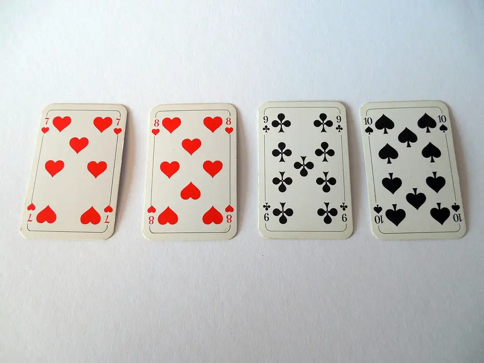 Playing cards on a white surface